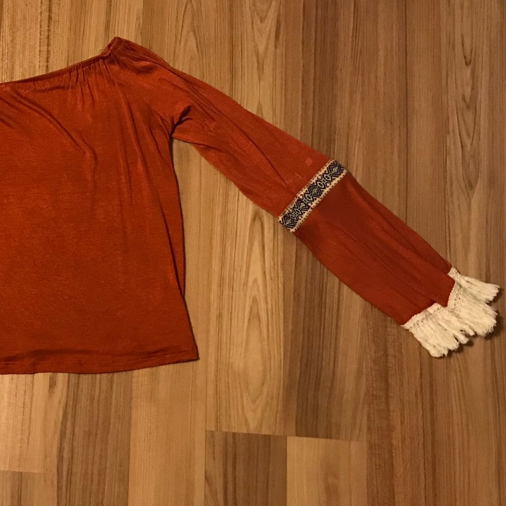 Orange off the shoulder long sleeve frilly top